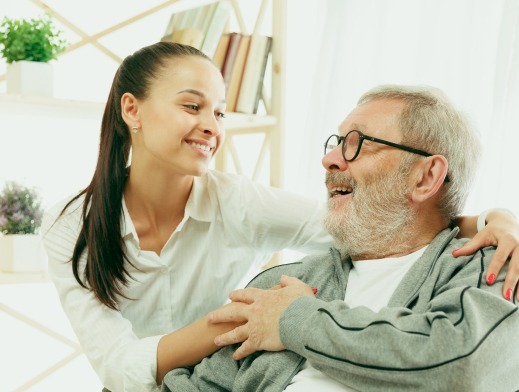Volunteer helping elderly resident in Burleson TX — Burleson Cares home repair program